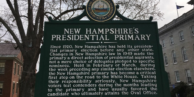 A sign outside the New Hampshire Statehouse in Concord, N.H. marks the state's cherished first-in-the-nation presidential primary.
