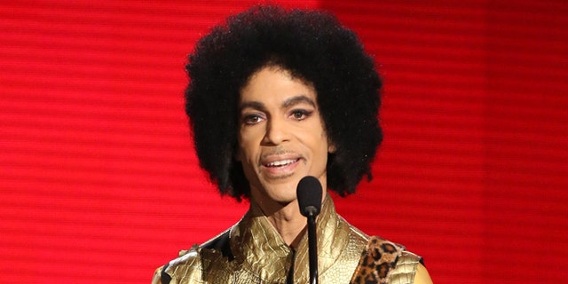 Nov. 22, 2015. Prince presents the award for favorite album - soul/R&amp;B at the American Music Awards in Los Angeles.