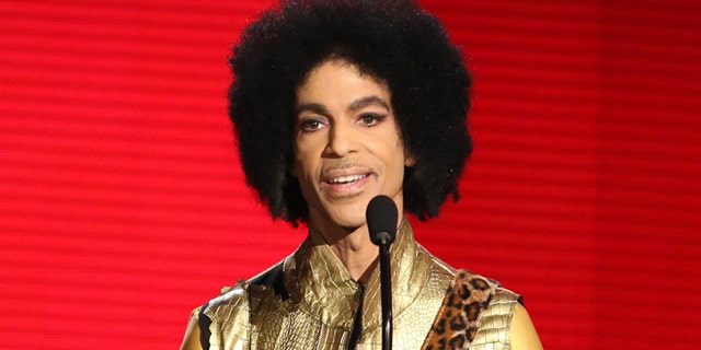 Nov. 22, 2015. Prince presents the award for favorite album - soul/R&B at the American Music Awards in Los Angeles.