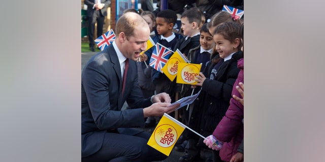 Britain's Prince William arrives with his wife Kate, Duchess of Cambridge to attend the Place2Be Big Assembly as part of the Heads Together campaign marking children's mental health week at the Mitchell Brook Primary School, north London, Monday Feb. 6, 2017. (Ian Vogler/Pool via AP)