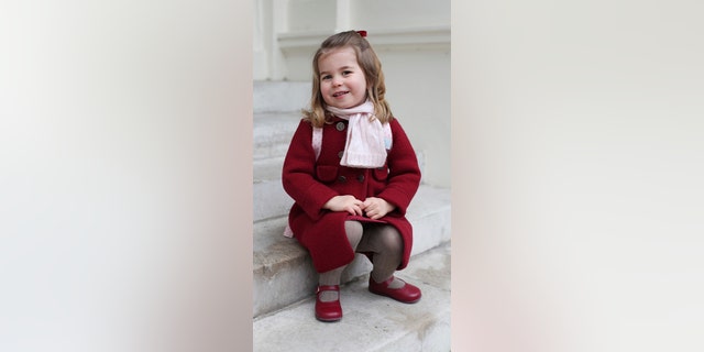 The youngest royal, Princess Charlotte, smiles as she prepares to attend her first day of school at the Willcocks Nursery School, in London, Monday, Jan. 8, 2018.