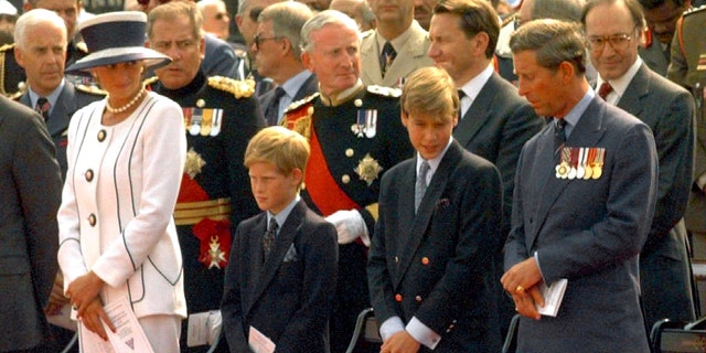 File photo - Princess Diana and Prince Charles, with their sons Prince Harry (L) and Prince William, stand outside Buckingham Palace August 19, 1995 during Britain's VJ (Victory over Japan) Day commemoration service (Reuters).