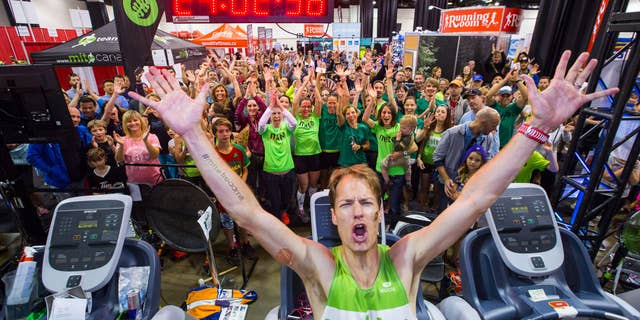 Dave Proctor celebrates setting the 24-hour treadmill record. (Photography by Neil Zeller)