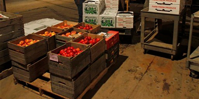 Shown here are produce cartons bound for families in New York City at Schoharie Valley Farms in Schoharie, N.Y., on July 21. (AP Photo)