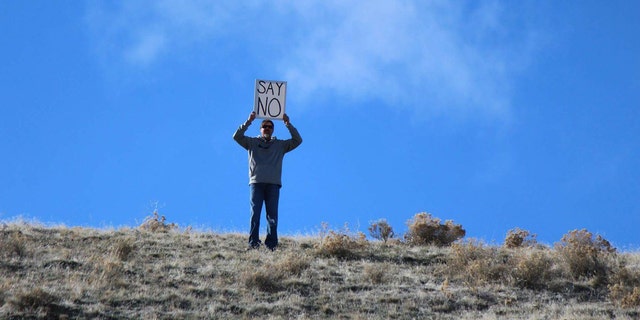 Jake Barron decided to troll his daughter Allison by holding the silly sign during her boyfriend's proposal.