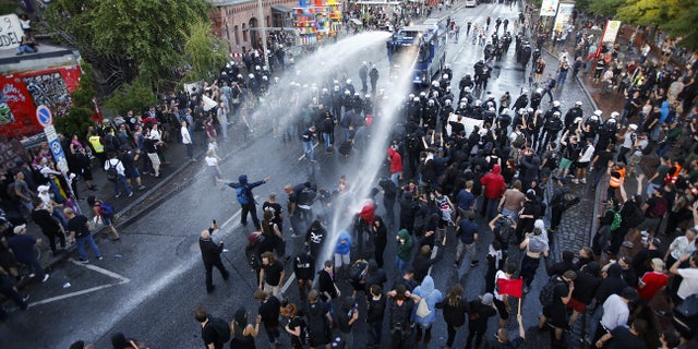 German riot police used water cannons against protesters demonstrating near the G-20 summit in Hamburg, Germany, on Thursday, July 6, 2017.