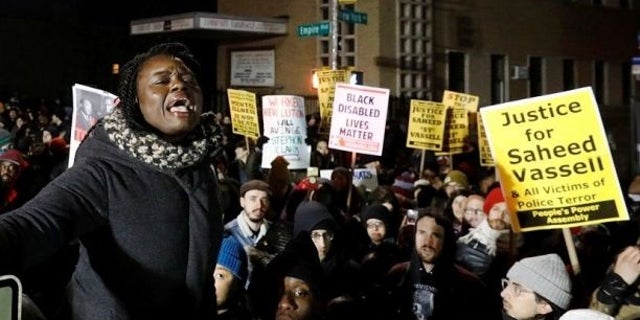 People respond to the fatal shooting of Saheed Vassell.