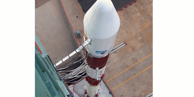 India's PSLV-C14 Rocket sits on the launch pad, awaiting take-off. The Indian space agency is accelerating plans for a manned space mission.