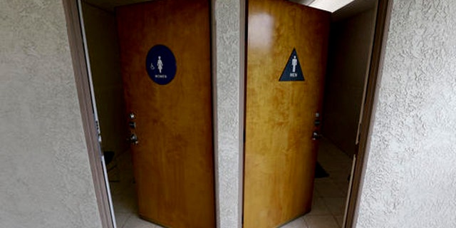 The doors to public restrooms are propped open at a office complex on Monday, May 9, 2016 in Anaheim, Calif.