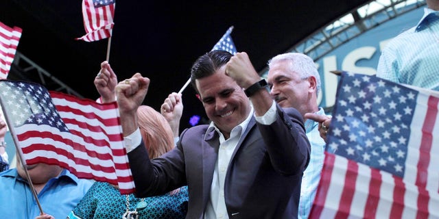 FILE -- Puerto Rico Governor Ricardo Rosello (C) celebrates after the economically struggling U.S. island territory voted overwhelmingly on Sunday in favour of becoming the 51st state, in San Juan, Puerto Rico June 11, 2017.