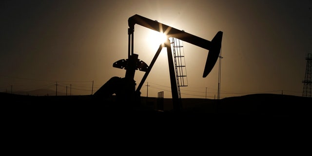 A pumpjack is seen at sunrise near Bakersfield, California. (Reuters, File)