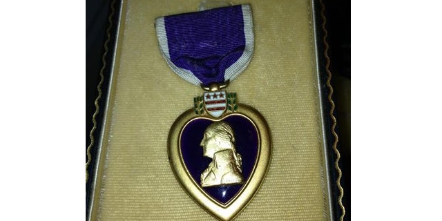 In this photo provided by Donna Gregory is the Purple Heart medal awarded to Pfc. John Farrell Eddington who was killed in action in Italy during World War II.