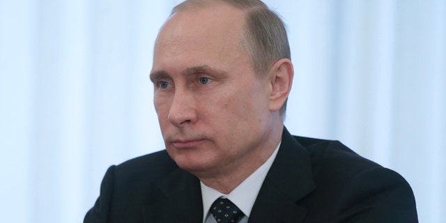 Feb. 13, 2014: Russian President Vladimir Putin listens during a meeting with Egyptian Defense Minister Field Marshal Abdel-Fattah el-Sissi in the Novo-Ogaryovo residence outside Moscow.