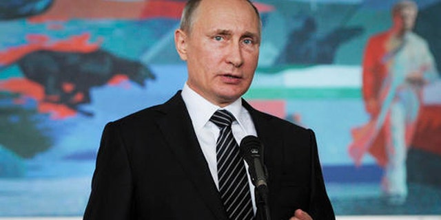 Russian President Vladimir Putin gestures while speaking during a news conference in Bishkek, Kyrgyzstan, Saturday. (Mikhail Klimentyev/Sputnik, Kremlin Pool Photo via AP)