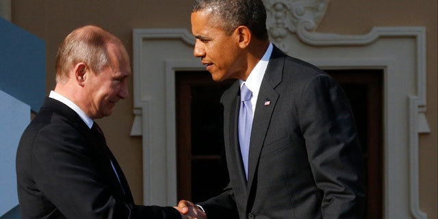 Sept. 5, 2013: Russia's President Vladimir Putin, left, welcomes President Obama before the first working session of the G20 Summit in Constantine Palace in Strelna near St. Petersburg, Russia.