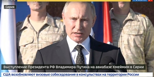 Russian President Vladimir Putin addresses to the troops at the Hemeimeem air base in Syria.