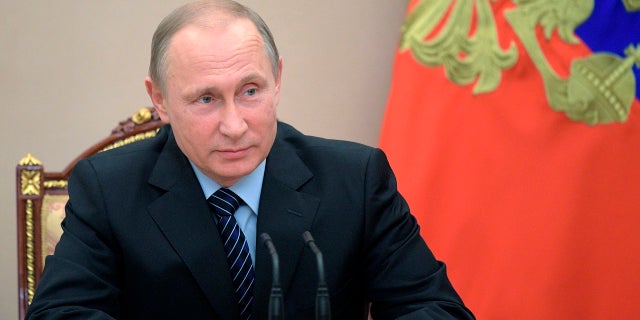 Russian President Vladimir Putin chairs a Security Council meeting in Moscow, Russia, Friday, June 16, 2017. The meeting was focused on the Russian military's claim that it had killed the Islamic State group's leader in an airstrike in Syria. (Alexei Druzhinin/Pool Photo via AP)