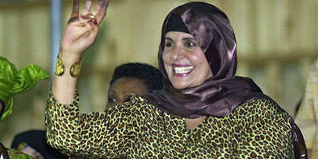 In this Monday, Sept. 1, 2003 file photo, showing Safiya Gadhafi, the wife of Libyan leader Muammar Qaddafi, waves at Libyan soldiers during a military parade at Tripoli's main square.