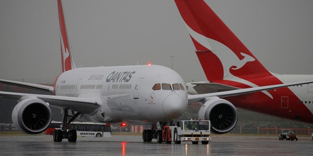Qantas Airline's airport lounge refused entry to singer Joanne Catherall because of her shoes.