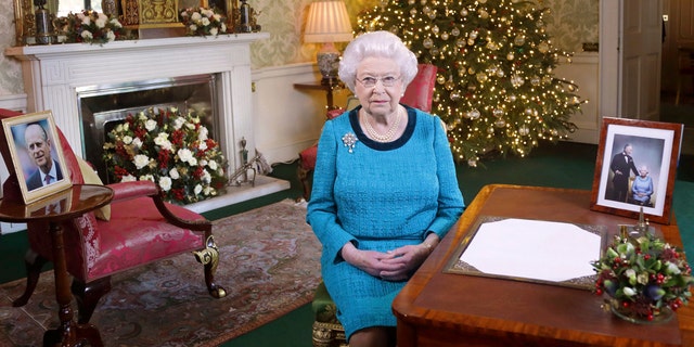 Dec. 25, 2016: Britain's Queen Elizabeth II poses for a photo while sitting at a desk in the Regency Room of Buckingham Palace in London, after recording her traditional Christmas Day broadcast to the Commonwealth.