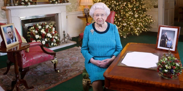 Dec. 25, 2016: Britain's Queen Elizabeth II poses for a photo while sitting at a desk in the Regency Room of Buckingham Palace in London, after recording her traditional Christmas Day broadcast to the Commonwealth.