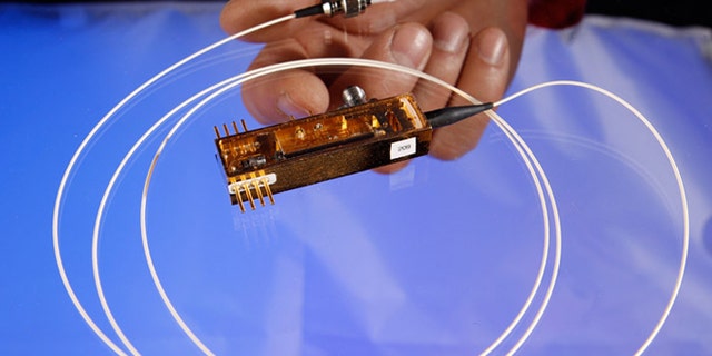 Feb. 14, 2013: Los Alamos National Laboratory completed the first-ever demonstration of securing control data for electric grids using quantum cryptography, with this miniature transmitter.