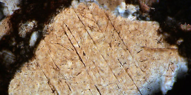 A photo taken through a microscope of shocked minerals from the Hummeln crater in Sweden.
