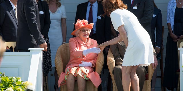 Susan Sarandon introduced herself to Queen Elizabeth at the Royal Windsor Cup polo match held at the Guards Polo Club in Egham, England on June 24.