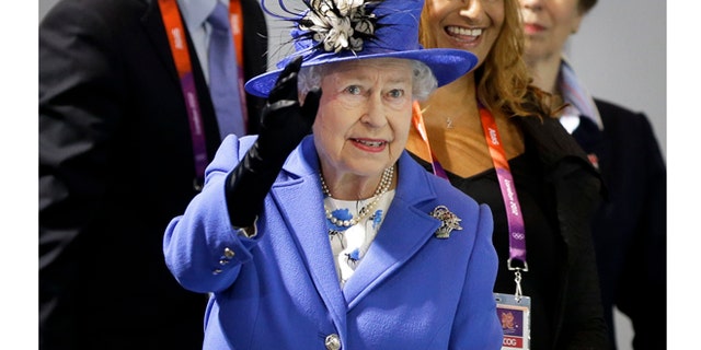 July 28, 2012: Queen Elizabeth II waves to spectators inside the Aquatics center at the 2012 Summer Olympics.