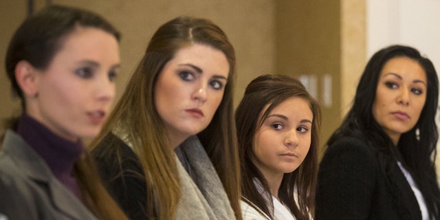 From the left; Rachael Denhollander, Sterling Riethman, Kaylee Lorincz, Jeanette Antolin and Tiffany Thomas appear at a press conference after Larry Nassar was sentenced to 60 years in prison on child pornography charges in Grand Rapids, Mich., on Thursday, Dec. 7, 2017. The women are some of the many former patients of Nassar who have accused him of molestation. Nassar was convicted of possessing child pornography and assaulting gymnasts.
