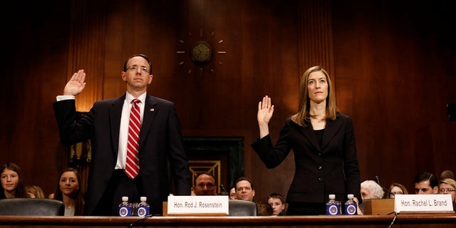 Rod Rosenstein, nominee to be Deputy Attorney General, and Rachel Brand, nominee for Associate Attorney General, are sworn before the Senate Judiciary Committee on Capitol Hill in Washington March 7, 2017. REUTERS/Aaron P. Bernstein - RTS11TPK