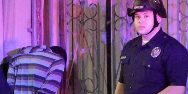 FILE: July 15, 2013: Police arrest an individual at a rally regarding Trayvon Martin, whose death sparked a national debate over racial profiling, Los Angeles, Calif.