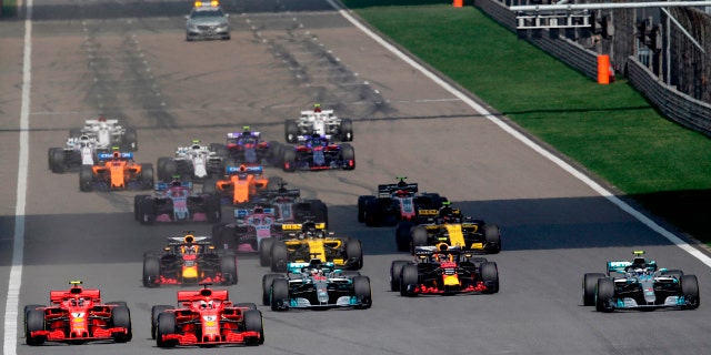 Ferrari driver Sebastian Vettel (5) of Germany leads the field at the start of the Chinese Formula One Grand Prix at the Shanghai International Circuit in Shanghai, Sunday, April 15, 2018.