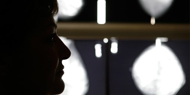 Vasiliki Kostoula, a breast cancer patient, listens to her doctor after a radiological medical examination. (REUTERS/Yannis Behrakis)