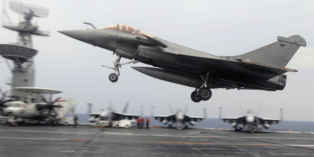 File photo - A French F-2 Rafale fighter performs a touch-and-go during combined French and American carrier qualifications aboard the aircraft carrier USS Theodore Roosevelt (CVN 71). The Theodore Roosevelt Carrier Strike Group is participating in Joint Task Force Exercise "Operation Brimstone" off the Atlantic coast. (U.S. Navy photo by Mass Communication Specialist 3rd Class Sheldon Rowley/Released)