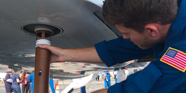 NOAA uses a high-altitude Gulfstream jet to launch up to 30 dropsondes, an expendable weather radar device about the size of the cardboard paper towel roll that falls into the ocean after recording weather data.