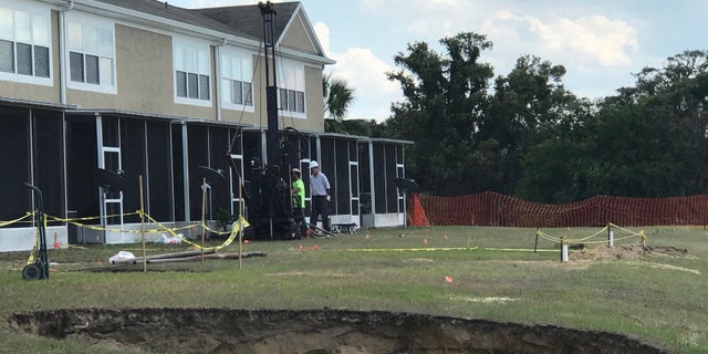 Sinkholes Leave Florida Neighborhood Look!   ing Like Cratered Wasteland - 