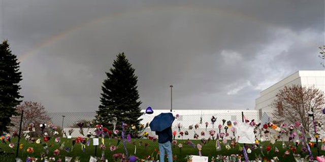 A rainbow appears over Paisley Park near a memorial for Prince, Thursday, April 21, 2016, in Chanhassen, Minn. Prince, widely acclaimed as one of the most inventive and influential musicians of his era with hits including "Little Red Corvette," ''Let's Go Crazy" and "When Doves Cry," was found dead at his home at Paisley Park on Thursday, according to his publicist. He was 57. (Carlos Gonzalez/Star Tribune via AP)
