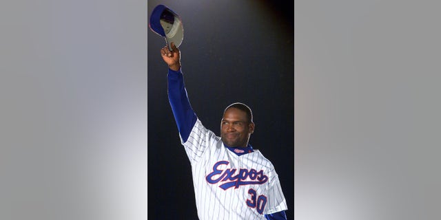 April 6, 2001: Tim Raines acknowledges applause from fans as he is presented before the Montreal Expos' home opener.