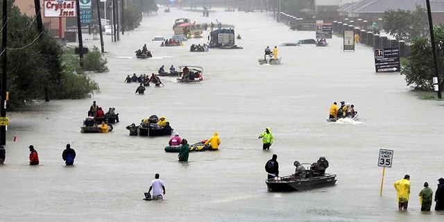 Federal regulators say dozens of offshore oil-and-gas platforms and rigs in the Gulf of Mexico have been evacuated as the storm continues to dump heavy rainfall on the region.
