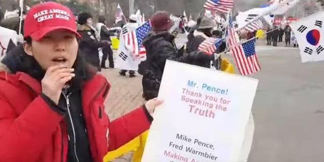 An activist at a rally in South Korea welcoming Mike Pence this month.