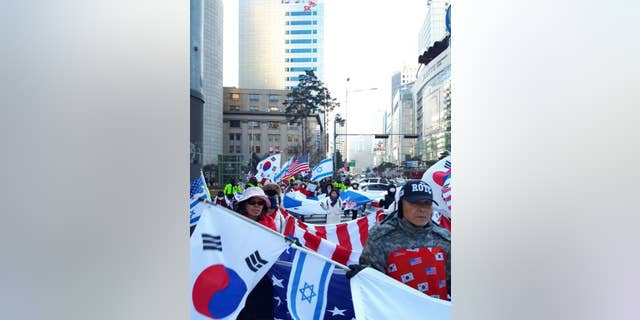 Israeli and American flags are often a staple at pro-Park rallies across South Korea.