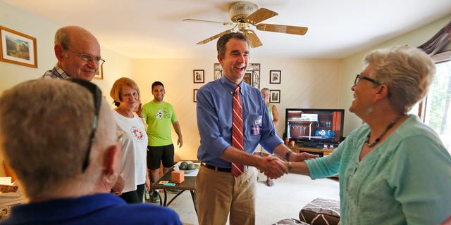Democratic candidate for governor, Lt. Gov. Ralph Northam greets voters at a canvas kickoff Tuesday, June 13, 2017, in Chesterfield, Va. Lt. Gov Ralph Northam faces former Congressman Tom Perriello in today's primary. (AP Photo/Steve Helber)