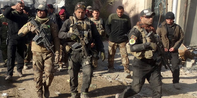 Dec. 28, 2015: Iraqi security forces enter the government complex in central Ramadi, 70 miles west of Baghdad, Iraq. (AP)