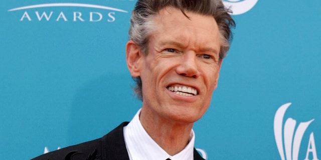 Singer Randy Travis arrives at the 45th annual Academy of Country Music Awards in Las Vegas, Nevada April 18, 2010.  REUTERS/Steve Marcus (UNITED STATES - Tags: ENTERTAINMENT PROFILE) - GM1E64J0HFS01