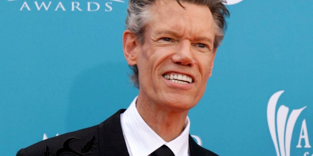 Singer Randy Travis arrives at the 45th annual Academy of Country Music Awards in Las Vegas, Nevada April 18, 2010. REUTERS/Steve Marcus (UNITED STATES - Tags: ENTERTAINMENT PROFILE) - GM1E64J0HFS01