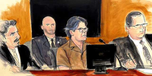 In this courtroom sketch Keith Raniere, second from right, leader of the secretive group NXIVM, attends a court hearing Friday in the Brooklyn borough of New York.