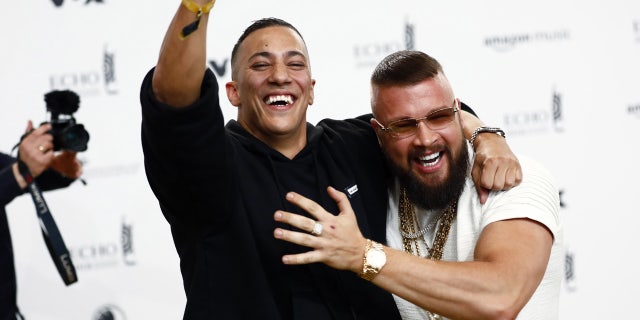 German rappers Kollegah, right, and Farid Bang pose upon arrival for the 2018 Echo Music Award ceremony.