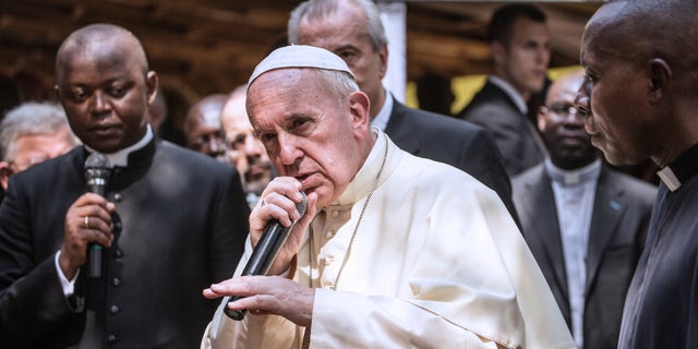 Pope Francis gestures as he gives his blessing in Bangui on November 29, 2015.