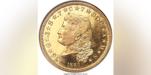 This undated image provided by Heritage Auctions shows an 1880 $4 gold piece called a "Flowing Hair Stella," considered one of the great rarities in America gold coins. The coin sold at auction for $750,000 during the annual Florida United Numismatists Convention, in Tampa, Fla., on Thursday, Jan., 4, 2018. (Heritage Auctions via AP)